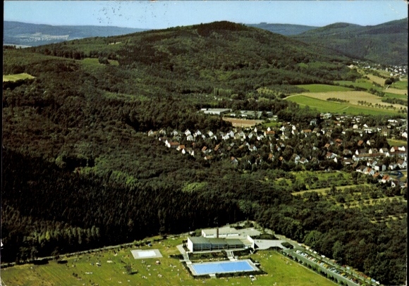 Postcard Kelkheim in the Taunus, landscape with forest, residential area and a swimming pool