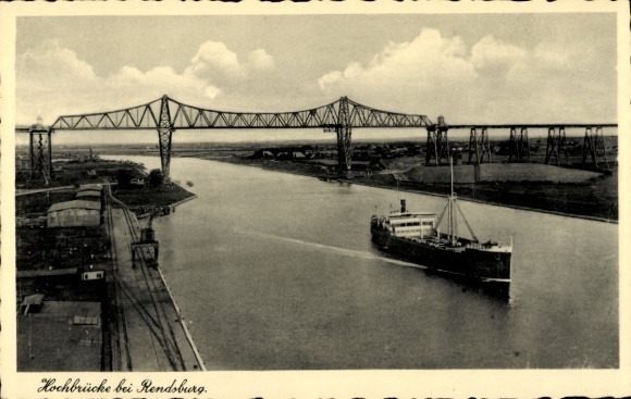 Postcard Rendsburg in Schleswig Holstein, high bridge, ship on waterway, clouds in the sky