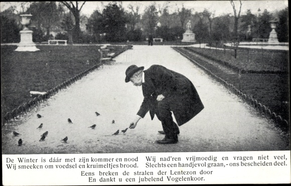 Postcard man feeds birds in winter