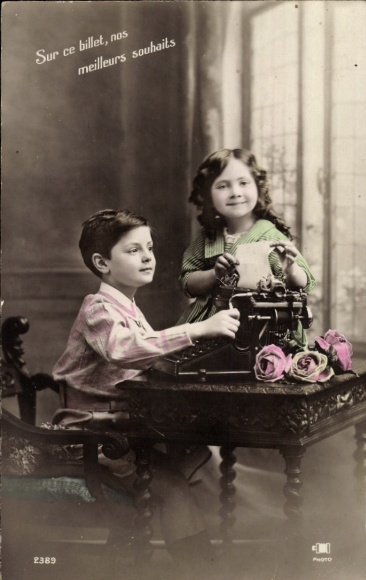 Postcard boy and girl with a typewriter