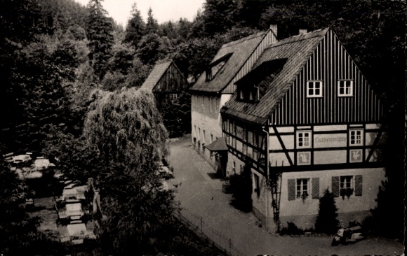 Postcard Kleinhennersdorf Gohrisch Saxon Switzerland, historic half-timbered house, surrounded by trees, i