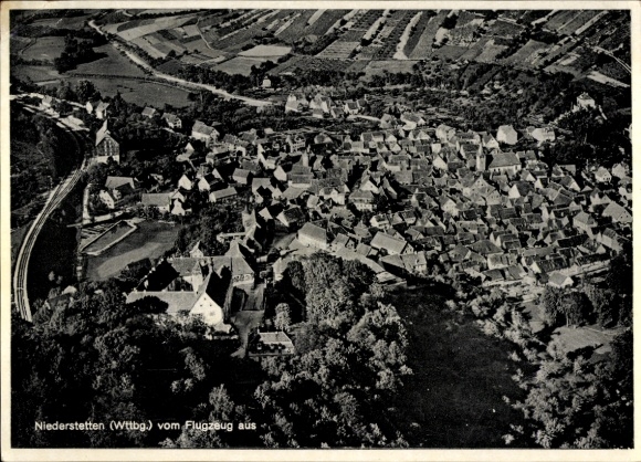 Postcard Niederstetten in Baden Württemberg, aerial view of several houses and landscape