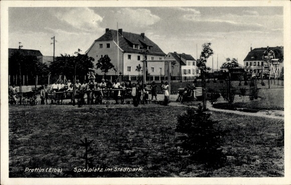 Postcard City Prettin Annaburg in the district of Wittenberg, playground in the city park, children on play equipment,