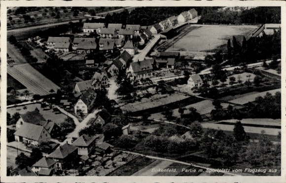 Postcard Birkenfeld an der Nahe, aerial view of sports field visible, houses, trees